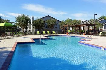 Resort-style swimming pool with sundeck